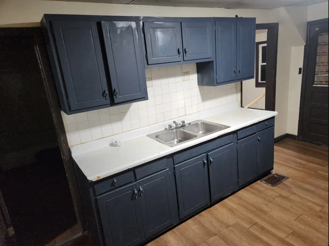 Navy blue kitchen cabinets before renovation